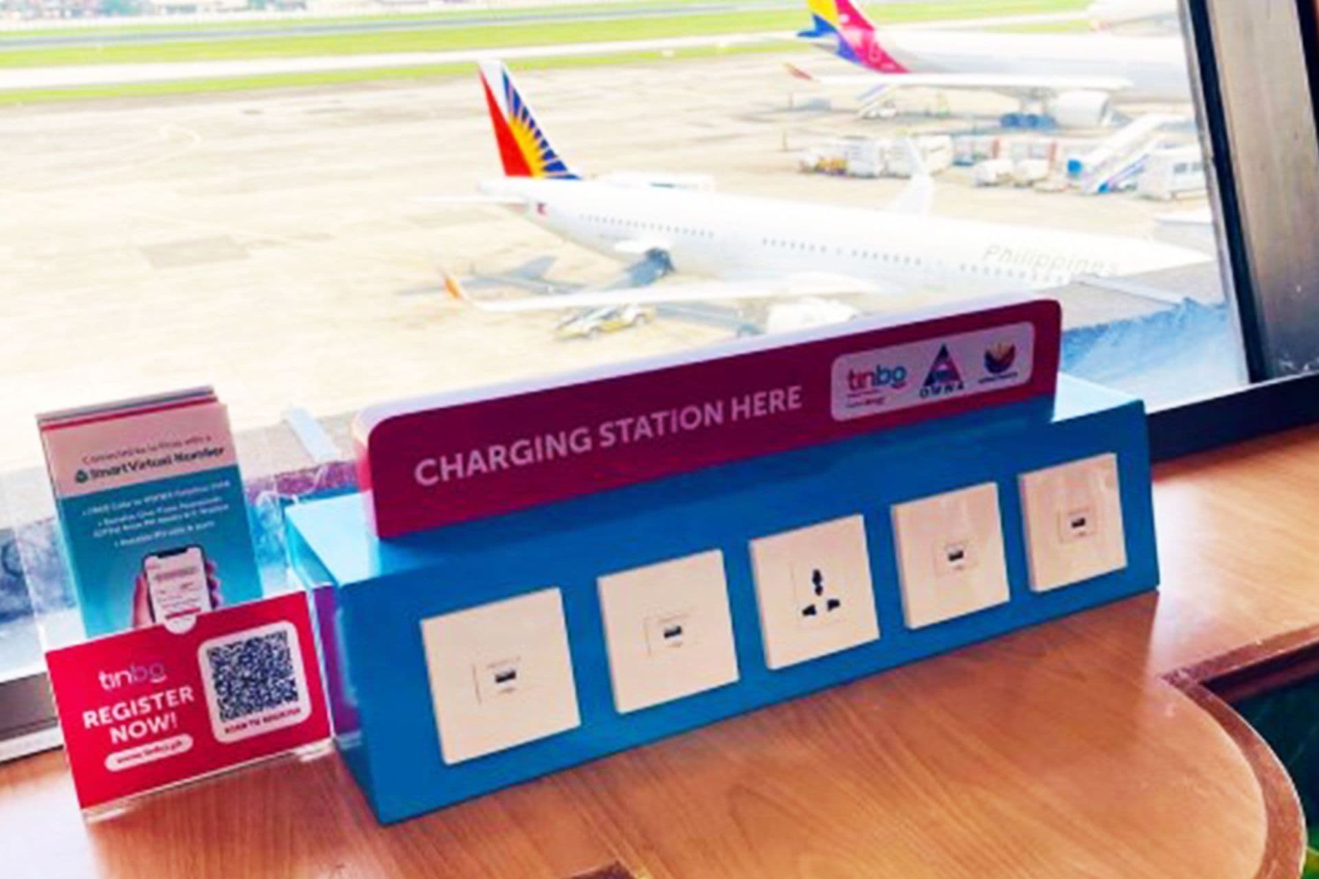 PLDT Global’s TINBO rolls out charging stations, booths for OFWs at DMW, NAIA